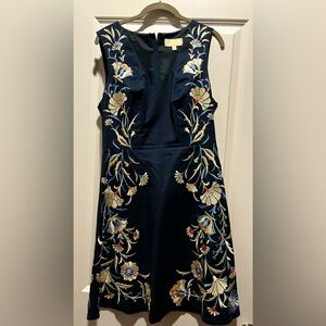 Embroidered navy sheath with v cutout neckline